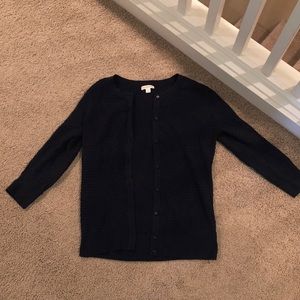 This is a 3/4 sleeve navy blue cardigan/button up